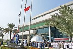 مدير وموظفو جمارك دبي يرفعون علم الإمارات في يوم الشهيد